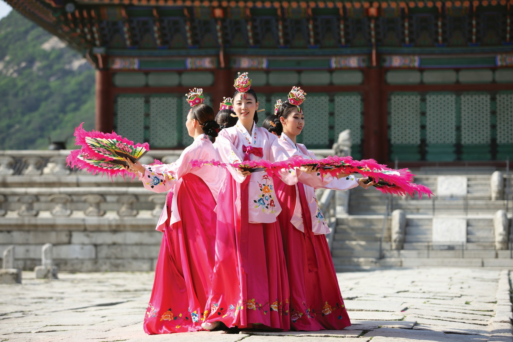 <b>Buchaechum (Fan Dance).</b> A traditional form of Korean dance usually performed by groups of female dancers holding fans with floral designs on them.