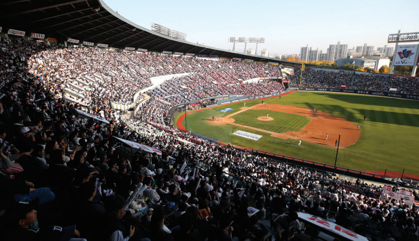 Jamsil Baseball Stadium is packed with baseball fans cheering enthusiastically