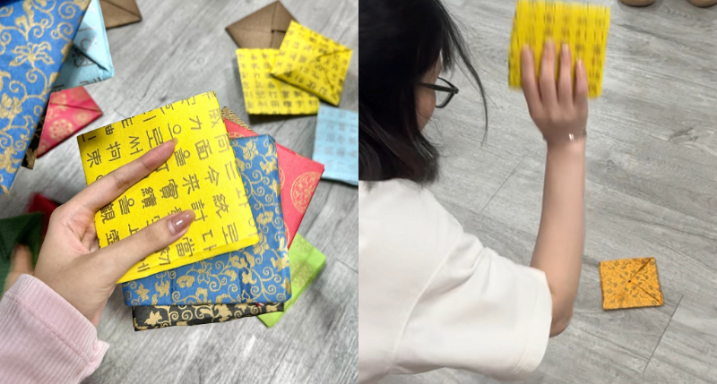 Takji là món đồ chơi làm bằng hai mảnh giấy cứng hình vuông dẹt ghép chồng lên với nhau. (Ảnh: Nguyễn Lâm Mỹ Duyên)